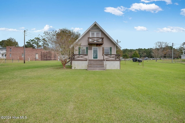 back of house with a yard