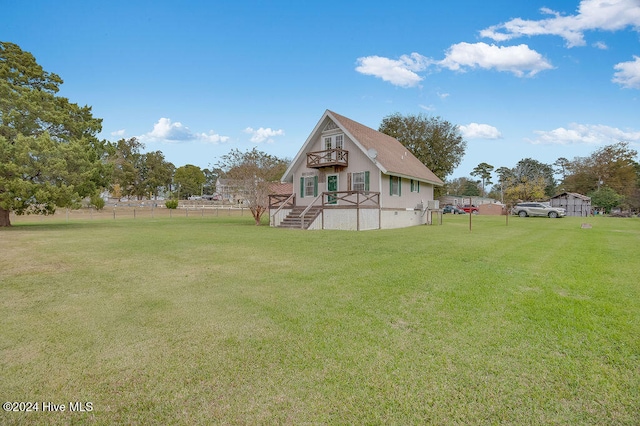 back of house featuring a lawn