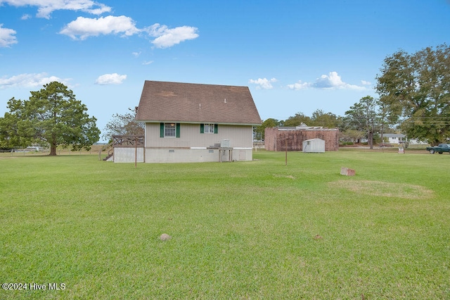 back of house with a yard