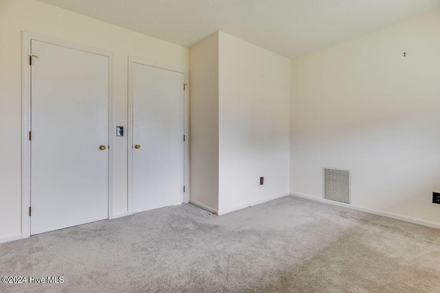 unfurnished bedroom with light carpet