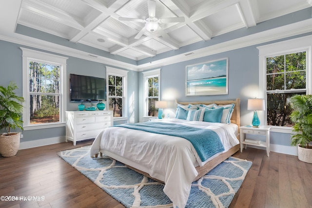 bedroom with ornamental molding, multiple windows, coffered ceiling, and hardwood / wood-style flooring