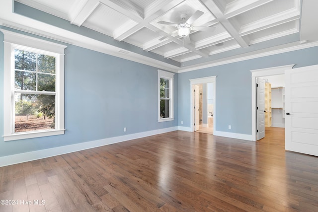 spare room featuring dark wood-type flooring, ornamental molding, coffered ceiling, beamed ceiling, and baseboards