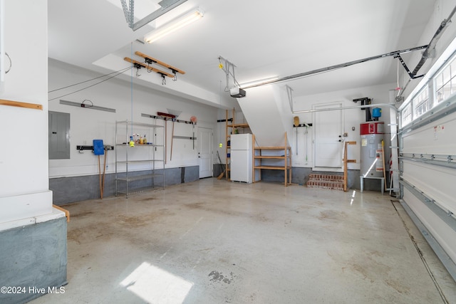 garage featuring a garage door opener, freestanding refrigerator, electric panel, and water heater