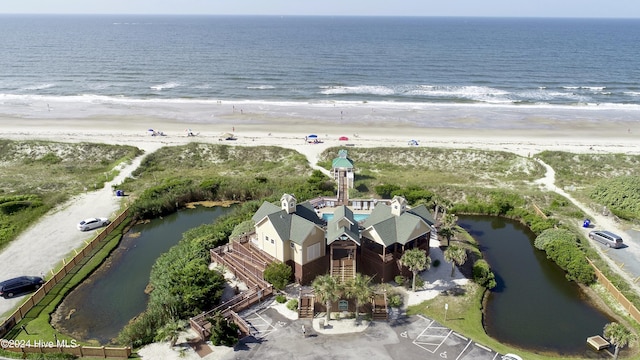 aerial view with a water view and a view of the beach