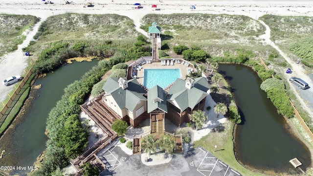 birds eye view of property with a water view