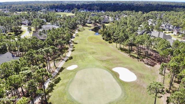 birds eye view of property with a residential view and golf course view