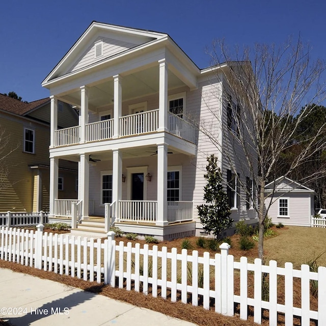 neoclassical / greek revival house with a balcony and a porch