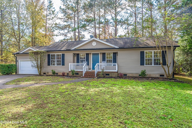 ranch-style home with a porch, a garage, and a front yard