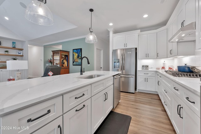 3314 Four Water Ln SW, Supply, NC 28462 - kitchen featuring a sink, under cabinet range hood, stainless steel appliances, white cabinetry, and hanging light fixtures