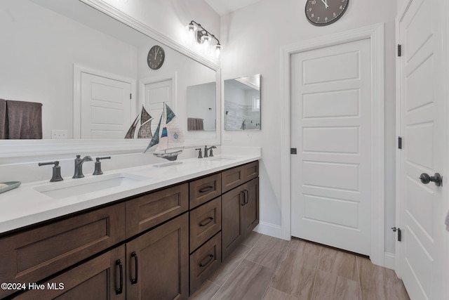 bathroom featuring vanity and wood-type flooring