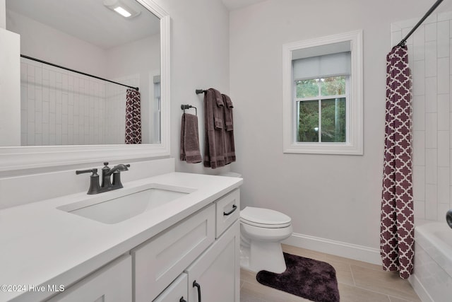 full bathroom with tile patterned floors, vanity, toilet, and shower / tub combo with curtain