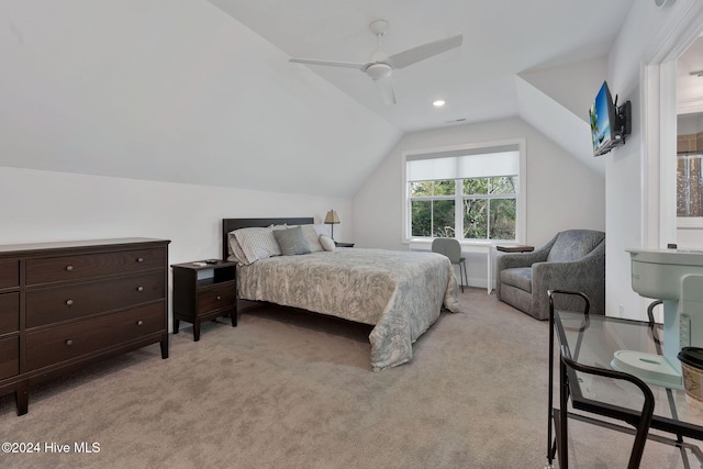 carpeted bedroom with ceiling fan and lofted ceiling