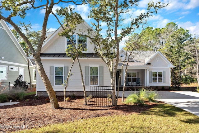 3314 Four Water Ln SW, Supply, NC 28462 - view of front facade featuring a porch, a standing seam roof, and metal roof