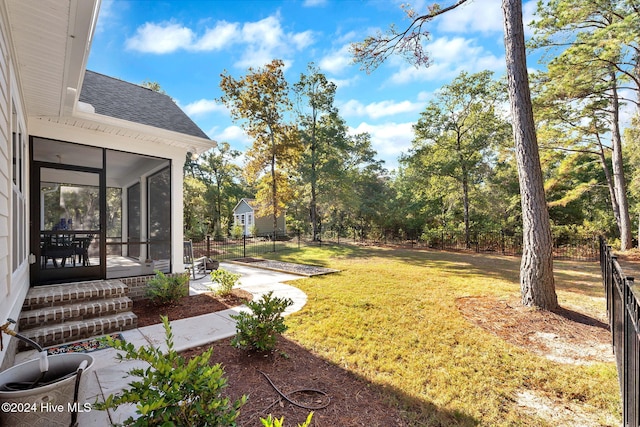 view of yard with a sunroom