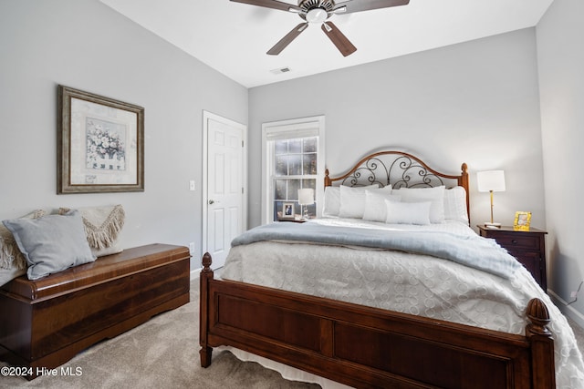 bedroom featuring ceiling fan and light colored carpet