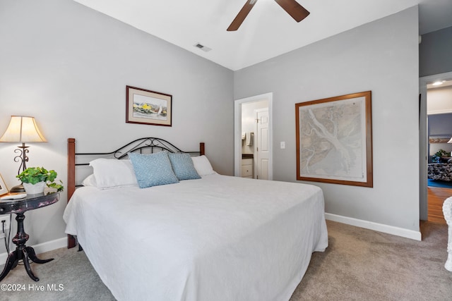 carpeted bedroom with ceiling fan and ensuite bathroom