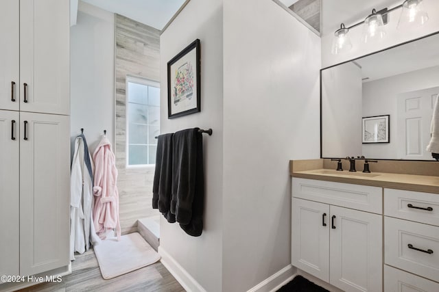 bathroom featuring hardwood / wood-style floors and vanity