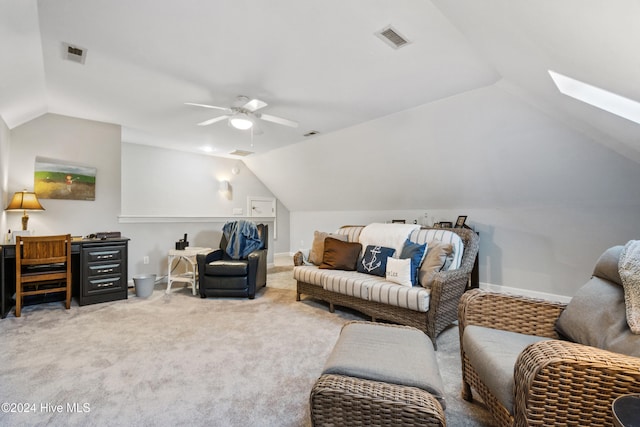 interior space with lofted ceiling with skylight and ceiling fan