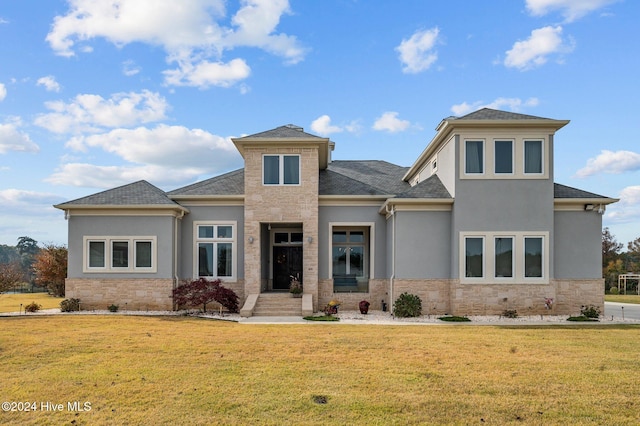 view of front of property with a front lawn