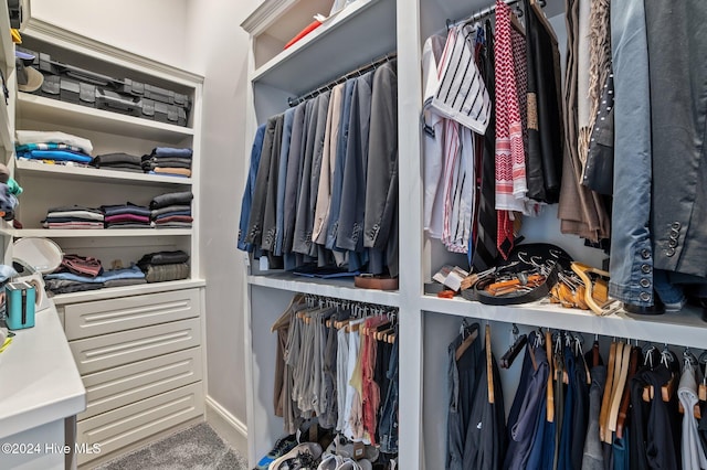 walk in closet featuring carpet floors