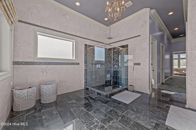 bathroom featuring a notable chandelier, an enclosed shower, ornamental molding, and tile walls