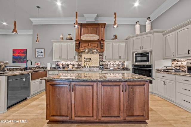 kitchen featuring white cabinets, decorative light fixtures, and stainless steel appliances