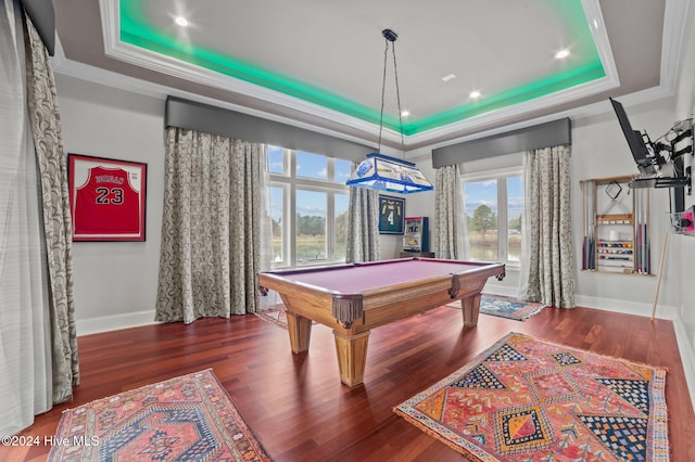 playroom with a raised ceiling, ornamental molding, dark wood-type flooring, and billiards