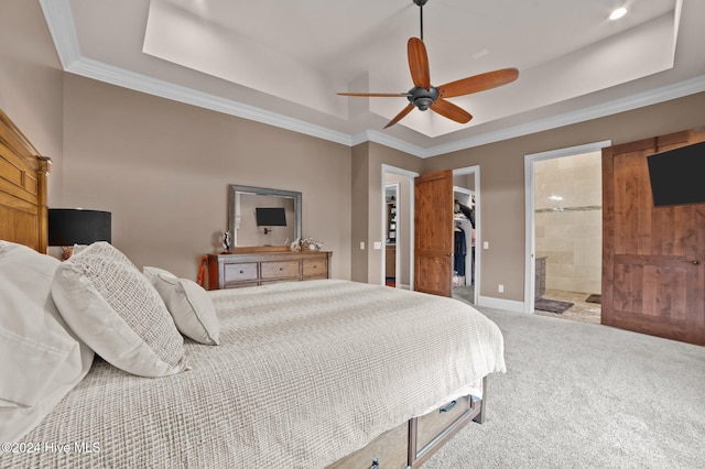 carpeted bedroom featuring ensuite bathroom, ceiling fan, a spacious closet, ornamental molding, and a closet