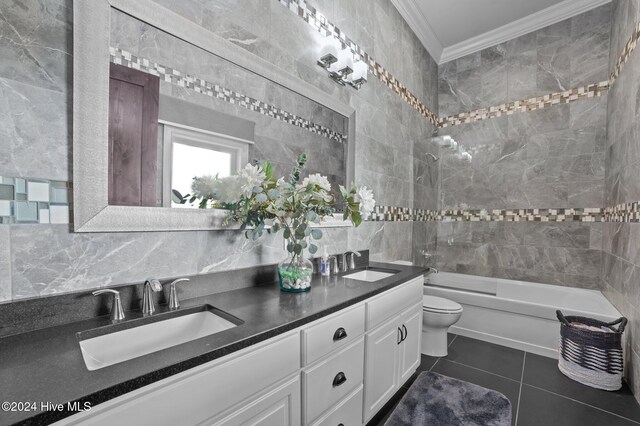 full bathroom featuring vanity, tile patterned flooring, decorative backsplash, toilet, and ornamental molding