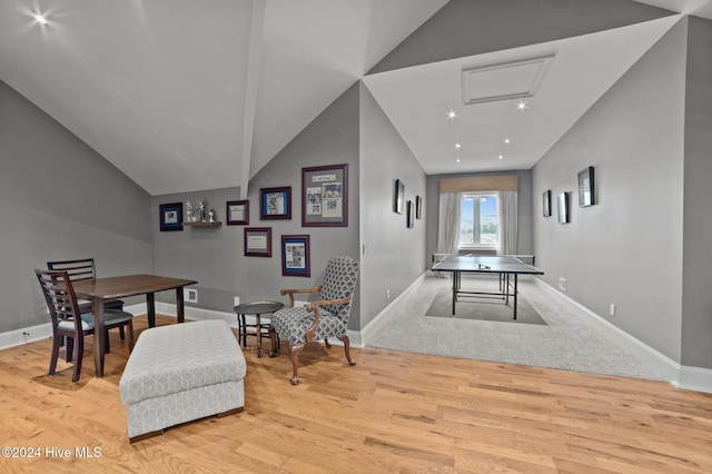 interior space with lofted ceiling and light hardwood / wood-style flooring