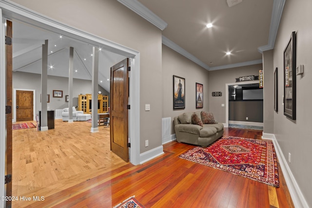 corridor with crown molding and hardwood / wood-style flooring