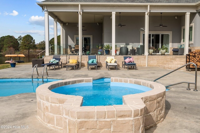 view of swimming pool featuring a patio and ceiling fan