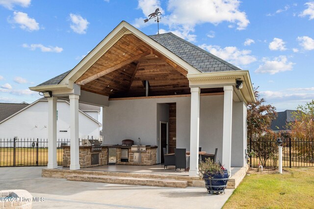 exterior space featuring area for grilling and a patio area