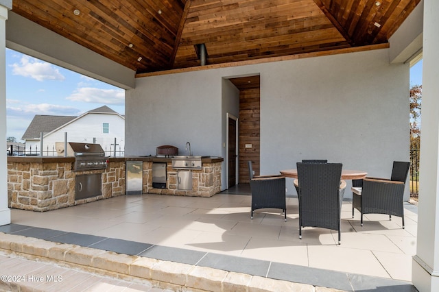 view of patio / terrace featuring area for grilling, sink, and grilling area