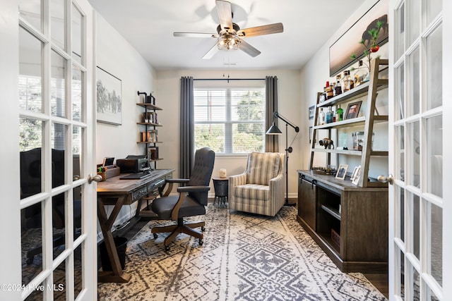 office featuring ceiling fan, french doors, and light wood-type flooring