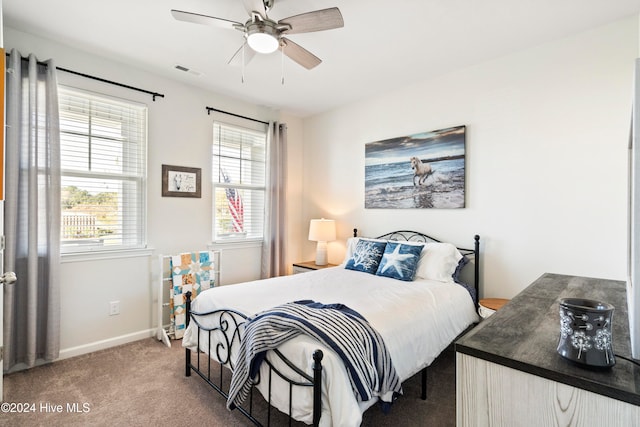 carpeted bedroom featuring ceiling fan