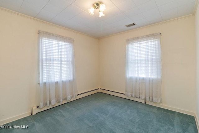 spare room with carpet floors, ornamental molding, and a wealth of natural light