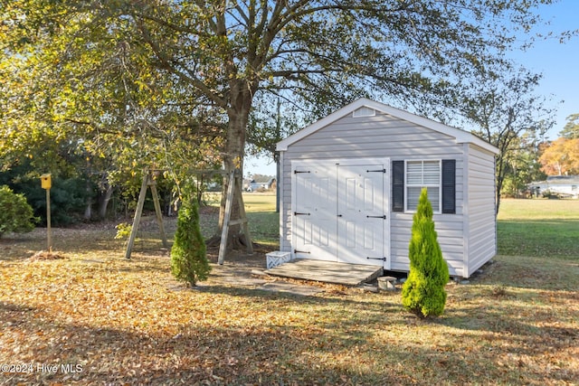 view of outdoor structure with a yard