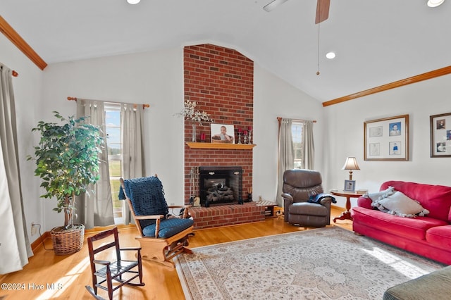 1221 NC Highway 305, Aulander, NC 27805 - living room with vaulted ceiling, wood finished floors, plenty of natural light, a fireplace, and crown molding