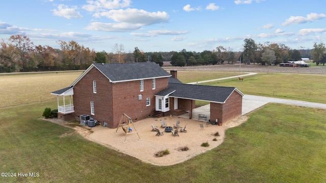 1221 NC Highway 305, Aulander, NC 27805 - view of property exterior with brick siding, entry steps, a lawn, a chimney, and a patio area