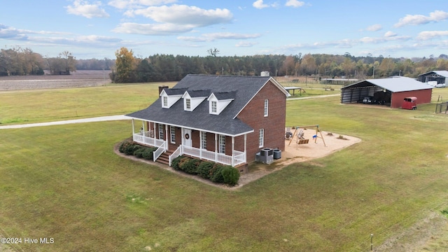1221 NC Highway 305, Aulander, NC 27805 - view of front of property with a porch, a carport, a front yard, and a shingled roof