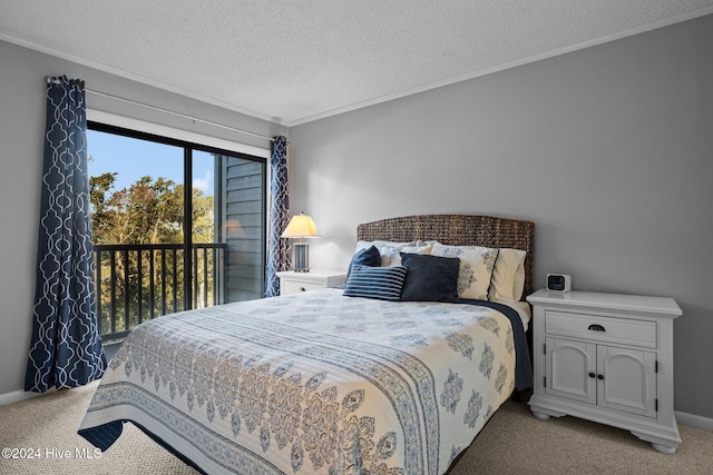 carpeted bedroom featuring ornamental molding and a textured ceiling