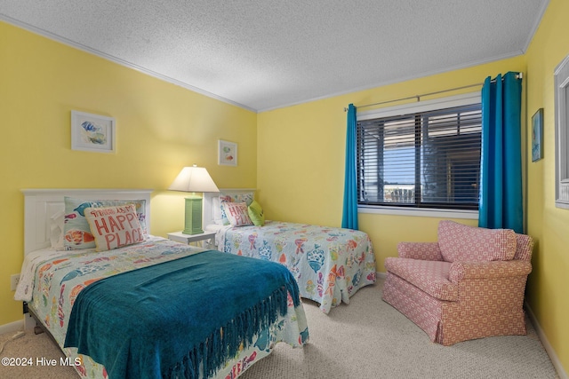 bedroom featuring carpet flooring, a textured ceiling, and ornamental molding