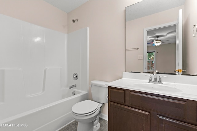 full bathroom featuring ceiling fan, shower / bathing tub combination, a textured ceiling, toilet, and vanity