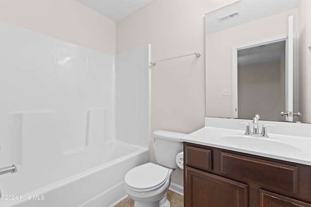 full bathroom featuring shower / bathing tub combination, vanity, a textured ceiling, and toilet