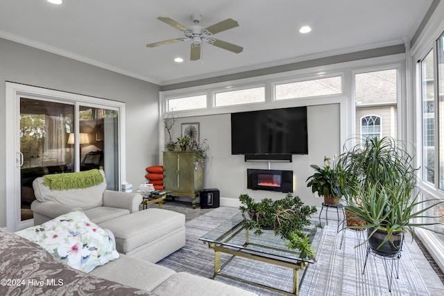 sunroom featuring ceiling fan and a healthy amount of sunlight