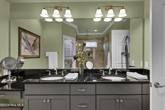 bathroom featuring vanity, walk in shower, and ornamental molding