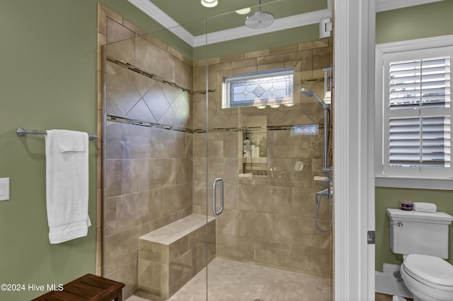 bathroom featuring toilet, ornamental molding, and walk in shower