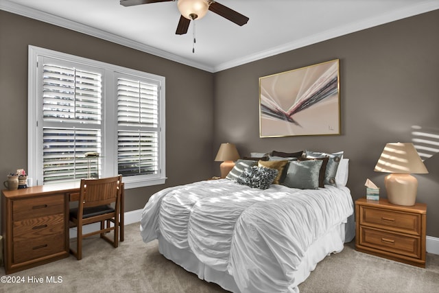 bedroom with light colored carpet, ceiling fan, and crown molding