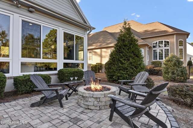 view of patio / terrace with a fire pit